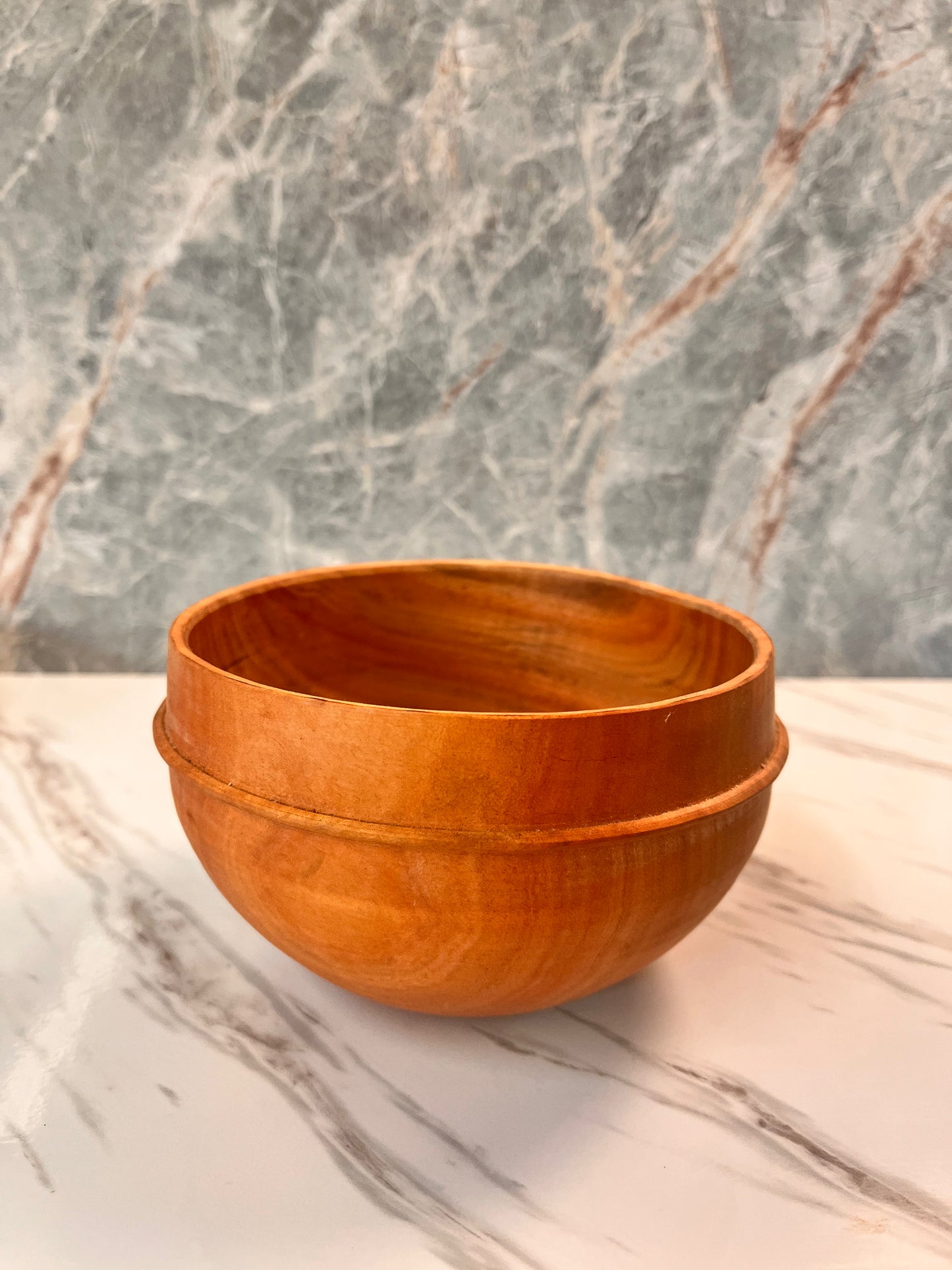 Eucalyptus bowl with a bead that measures 5 1/2" x 3 1/4"