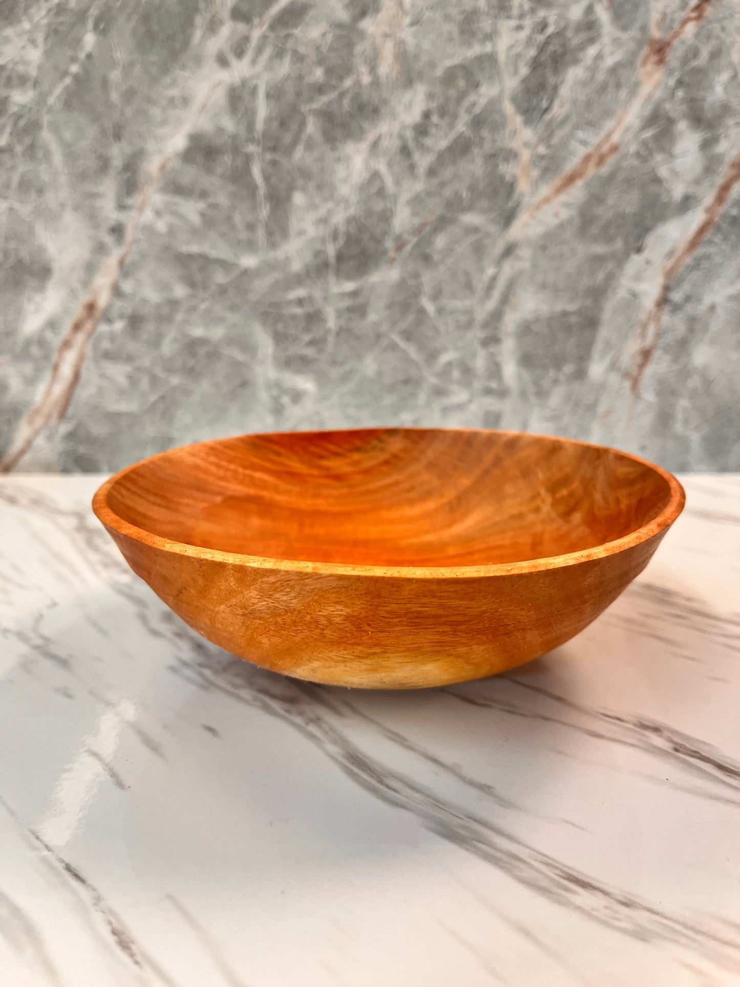 Slightly warped, eucalyptus bowl measures 6 1/2 x 2 1/4"