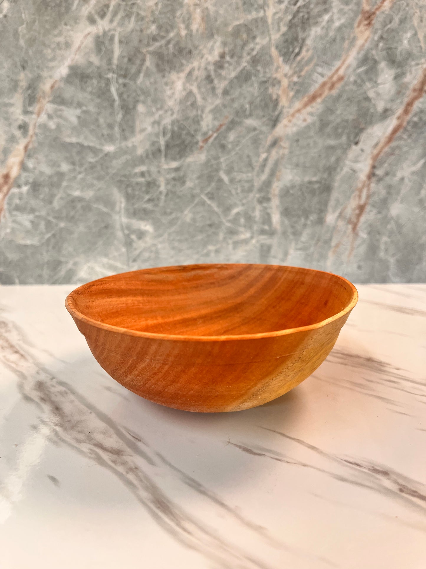 Small eucalyptus bowl with slightly warped edges measures 5 1/4" x 2"