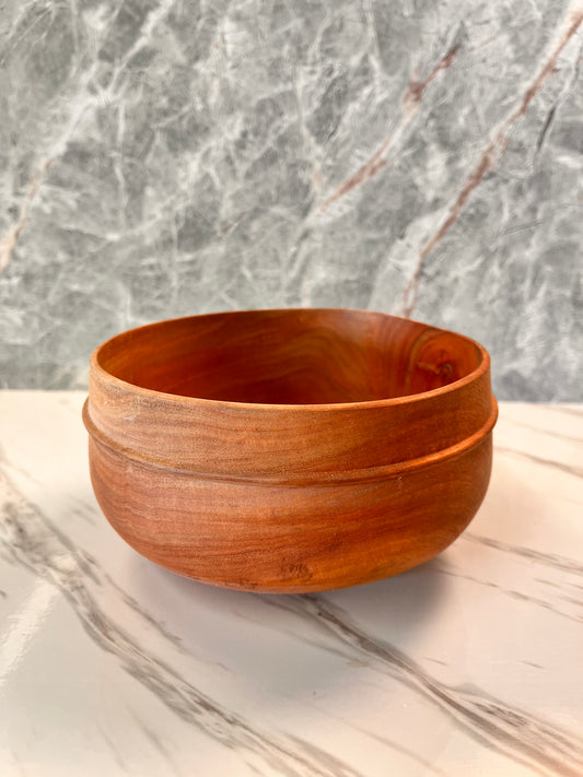 Eucalyptus bowl with a bead measures six and three-quarter inches by 3 1/2 inches